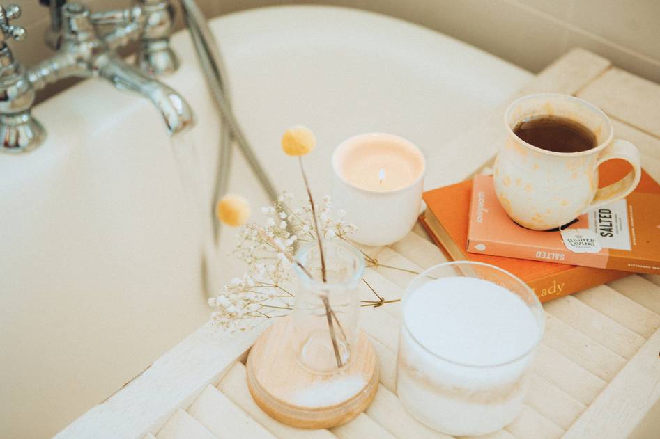 Woman relaxing in a foamy lavender bubble bath