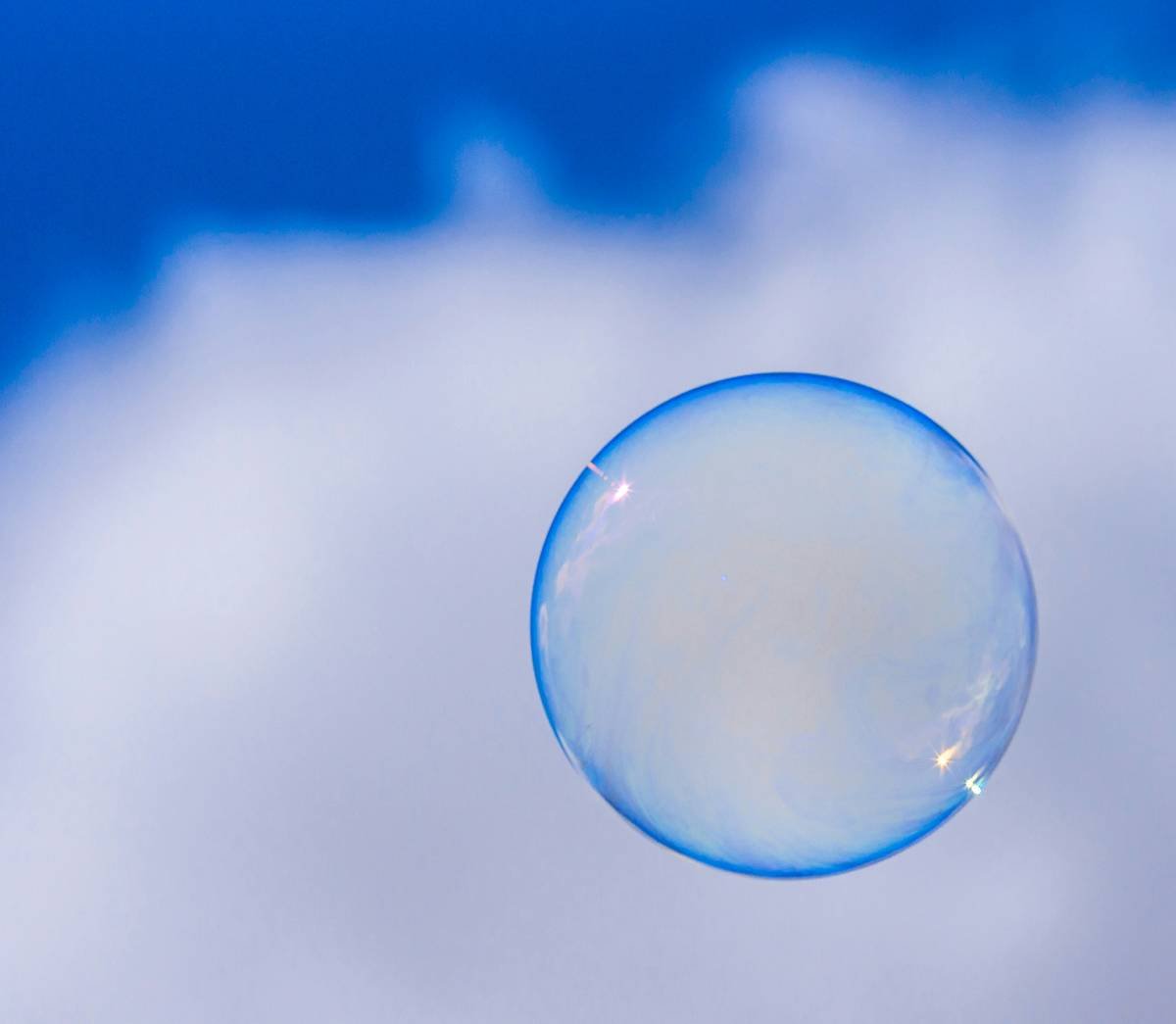 close-up of bath essential bubble brush beyond salt creating microfoam in filled bathtub
